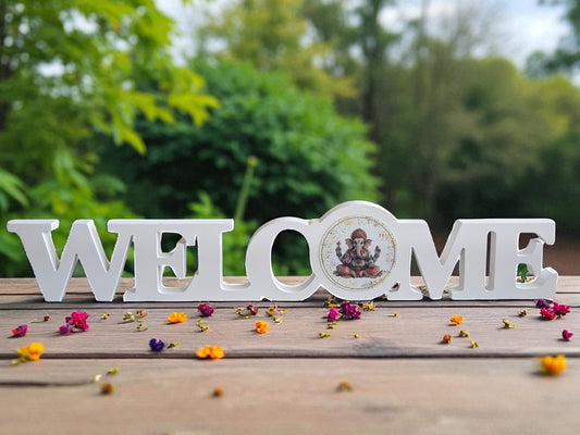 White Wooden “Welcome” Sign with Ganesh